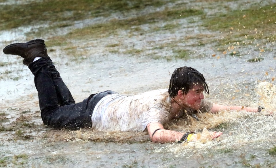  Another man attempts to SWIM in the mudbath at the country estate in Wetherby