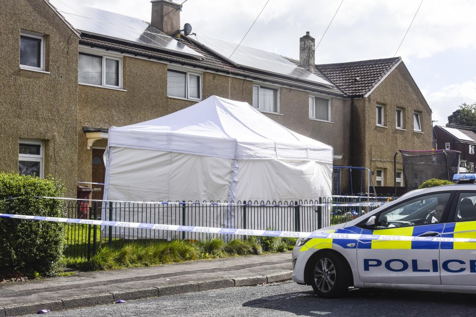  Police cordon off scene in Darwen, Lancs. where a 42-year-old man was found stabbed to death