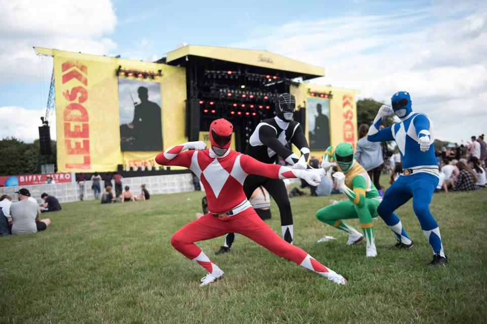  A group of lads dressed as Power Rangers clown around at Leeds festival