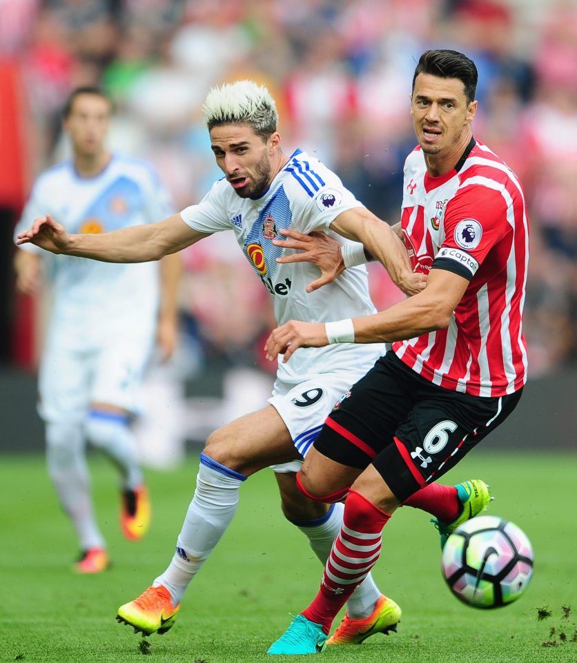 Fabio Borini is challenged by Saints skipper Jose Fonte 