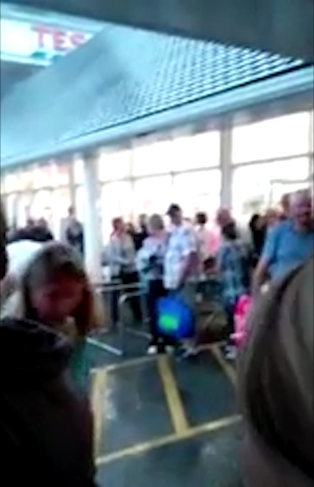 Evacuated ... Shoppers were ushered out of the shop's fire exits as rainwater flooded the store