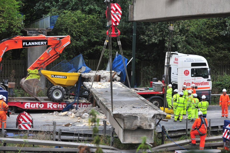  Cranes and bulldozers on scene trying to shift tonnes of concrete debris from the disaster