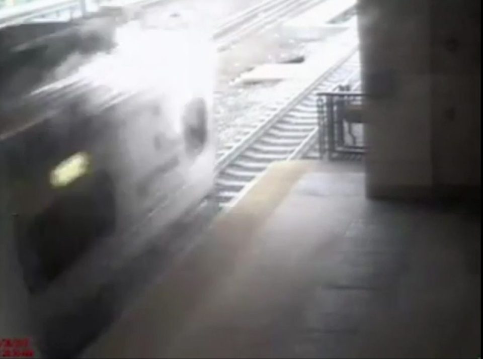  Train hurtles by mere moments later ... but Officer Ortiz has already yanked the man to safety