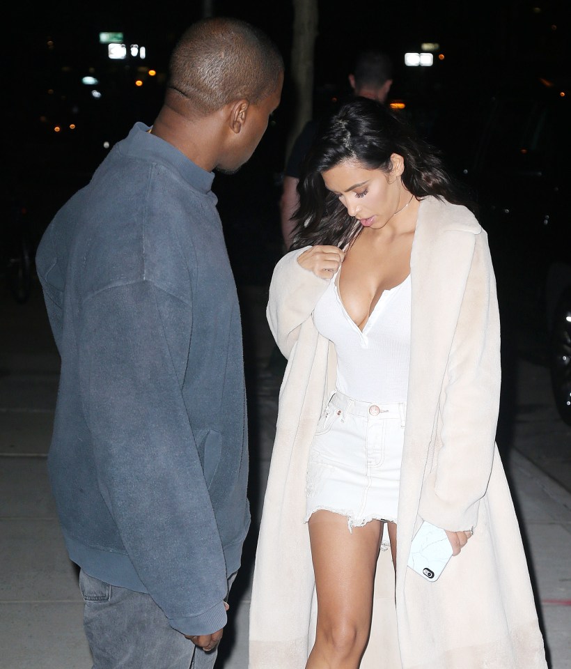 Kanye couldn't resist a cheeky peek at Kim's boobs