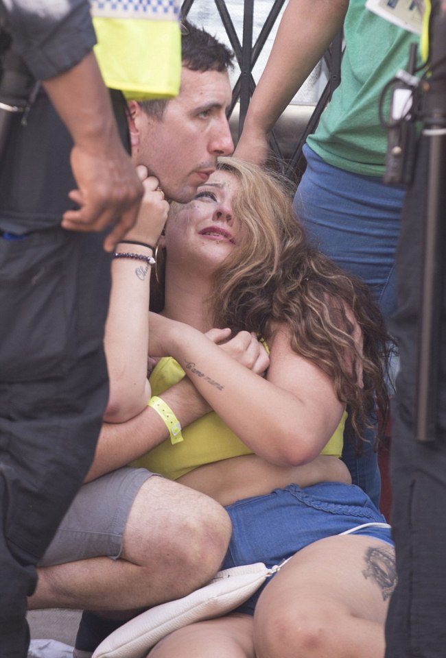  A young female reveller is seen collapsed on the pavement as violence erupted at the Notting Hill Carnival