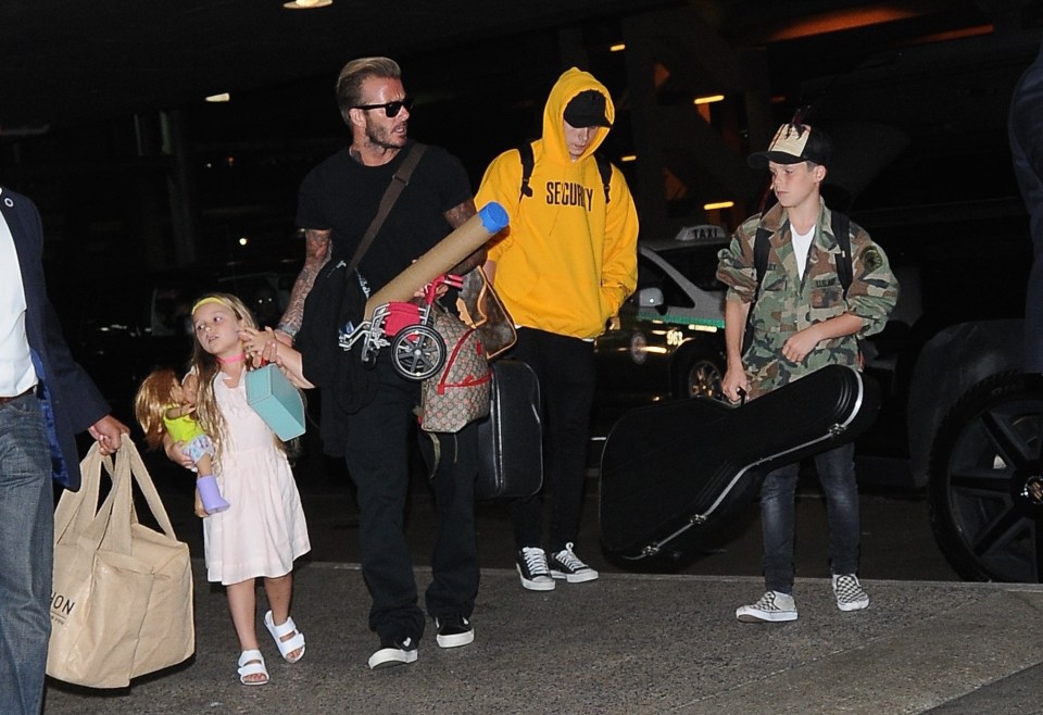  Beckham family pictured LAX carrying bulky hand-luggage