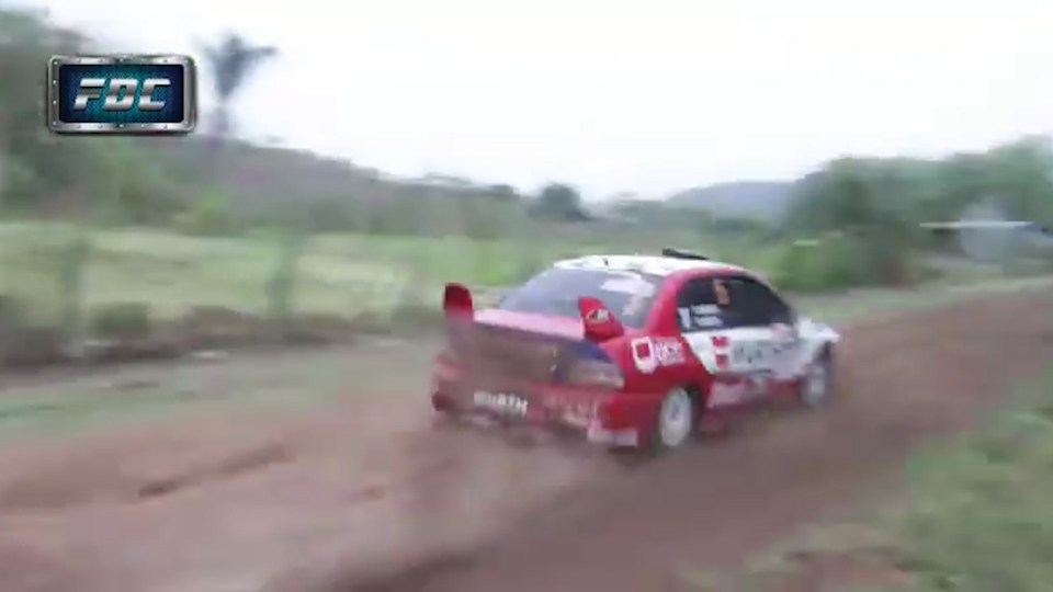  Rally car driven by Uruguayan Fernando Zuasnabar lands safely in front of danger dog