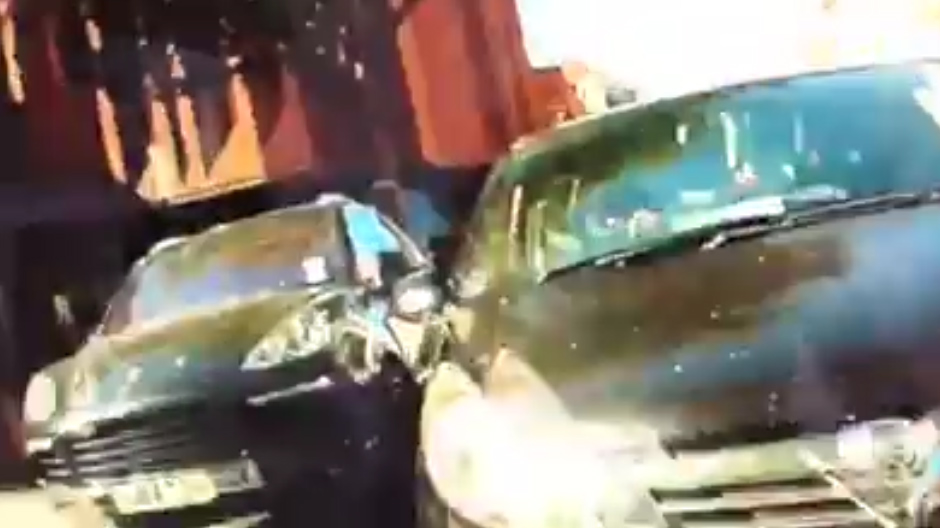  The furious motorist gets back into her vehicle and speeds off, missing crashing into a parked car by inches