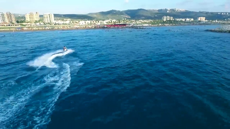  A man on a jet ski cuts through the waves on the promotional film