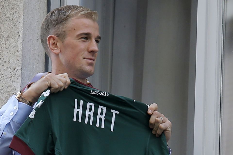 Joe Hart poses with the Torino shirt on his way to have a medical