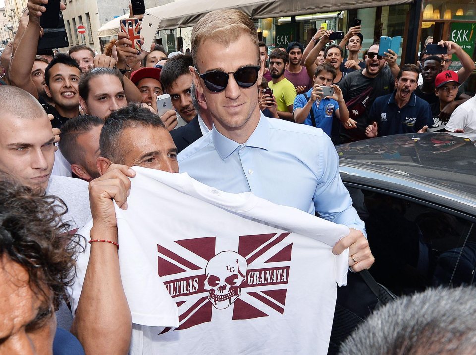  Joe Hart is mobbed by excited Torino fans as he jetted into Turin on Monday evening