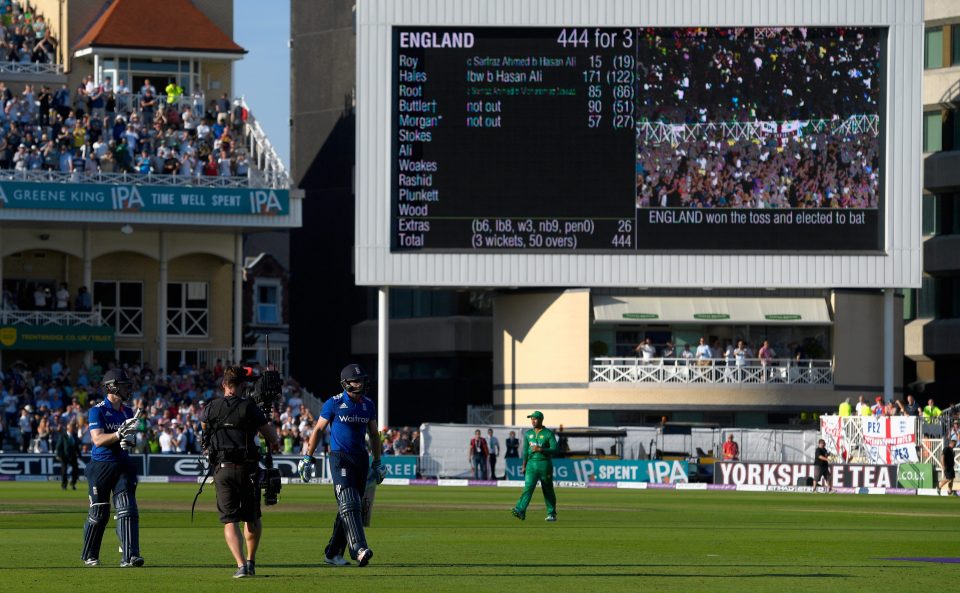  Eoin Morgan and Jos Buttler walk off after helping England to an ODI record score of 444-3