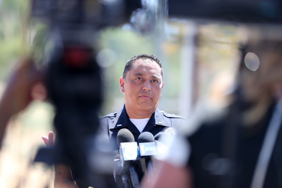 An LAPD spokesman gives waiting media the latest on the Chris Brown incident in Tarzana, CA.