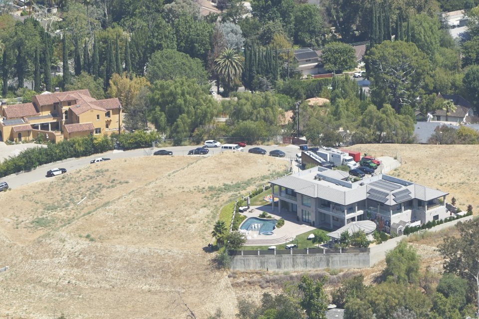 police at the home of Chris Brown who is accused of pulling a gun on a woman at his Los Angeles home