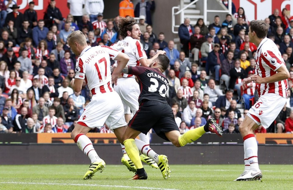  Nicolas Otamendi hits the deck as he is pulled down by Ryan Shawcross in the box