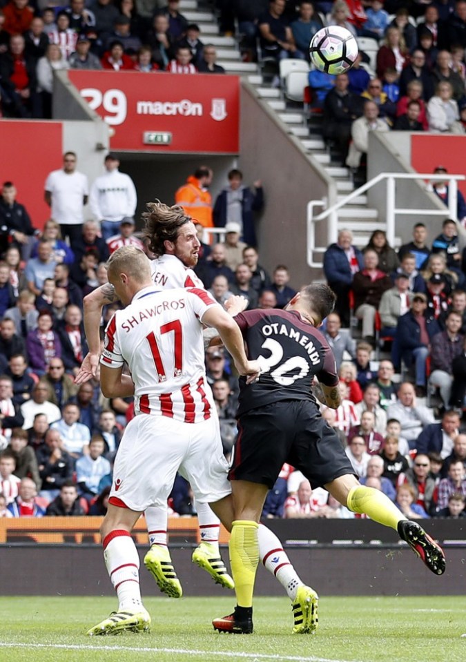  Ryan Shawcross concedes a penalty after pulling down Man City's Nicolas Otamendi