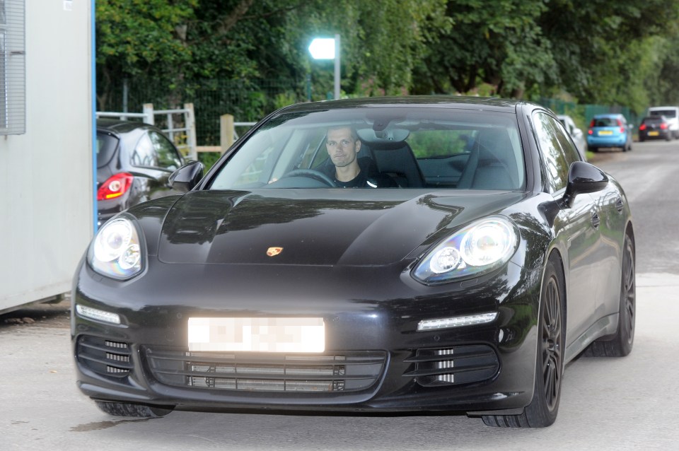  Morgan Schneiderlin driving in to Manchester United's Aon training complex in Carrington in his Porsche