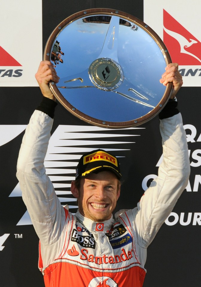  Jenson Button celebrates on the podium after winning the Australian Grand Prix in 2012