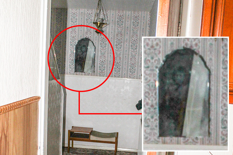  Ghostly image appears in mirror in hallway of home that has been terrorised by spectre for half a century