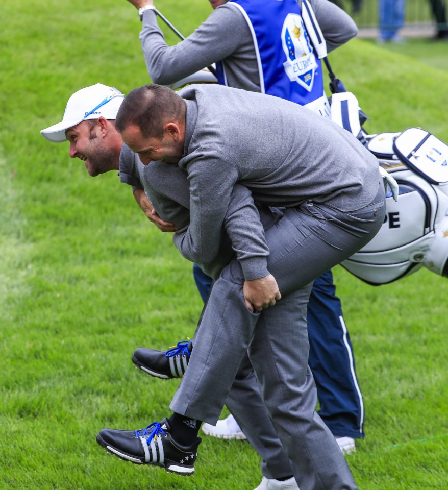  Sergio Garcia and Andy Sullivan show the brotherly nature of the Europe team