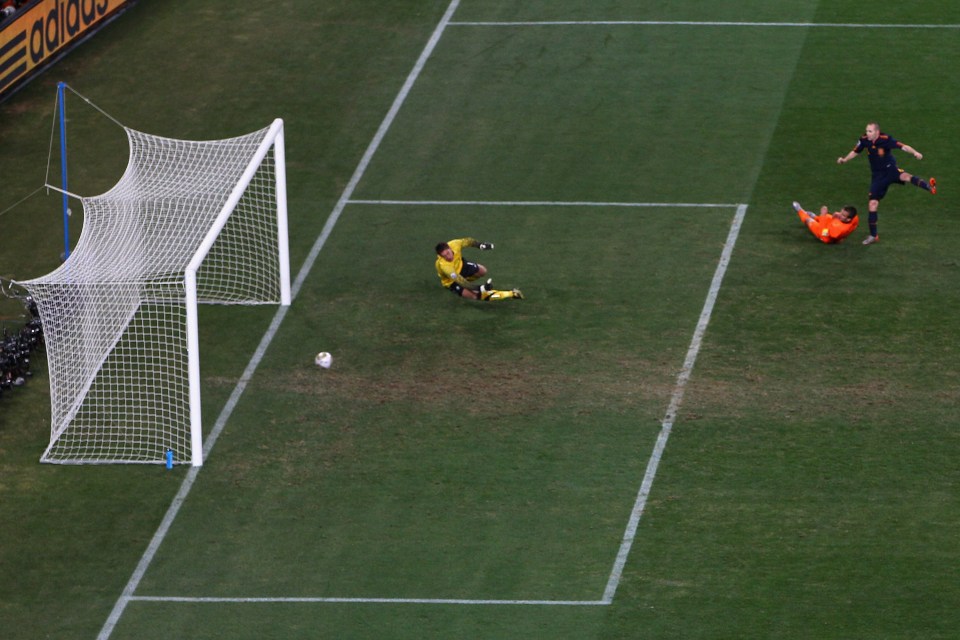  Andres Iniesta puts the ball past Maarten Stekelenburg to win World Cup for Spain