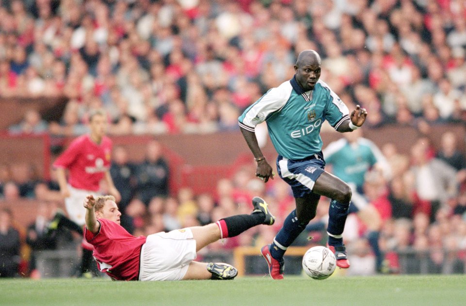 George Weah in action for Manchester City against United in 2000-01