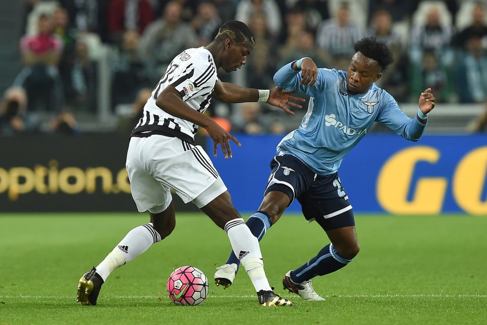  Ogenyi Onazi puts in a challenge on Paul Pogba during Lazio-Juventus clash