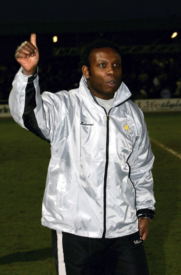 TORQUAY, UNITED KINGDOM - JANUARY 07: Torquay manager Leroy Rosenior waves triumphantly to the fans after the 0-0 draw in the FA Cup Third round game between Torquay United and Birmingham City on January 7,2005 at Plainmoor, Torquay, England. (Photo by Stu Forster/Getty Images)