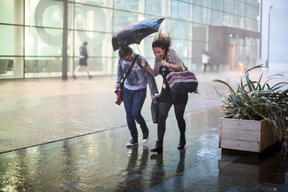 People rushed to shelter from heavy rain as storms hit the north of England