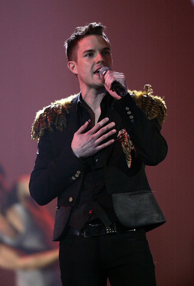  Brandon Flowers of the Killers performs onstage with Outstanding Contribution To Music Winners Pet Shop Boys, during the BRIT Awards