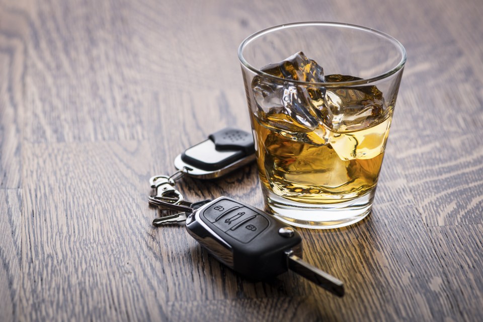 Drunk driving whisky drink shot and car keys