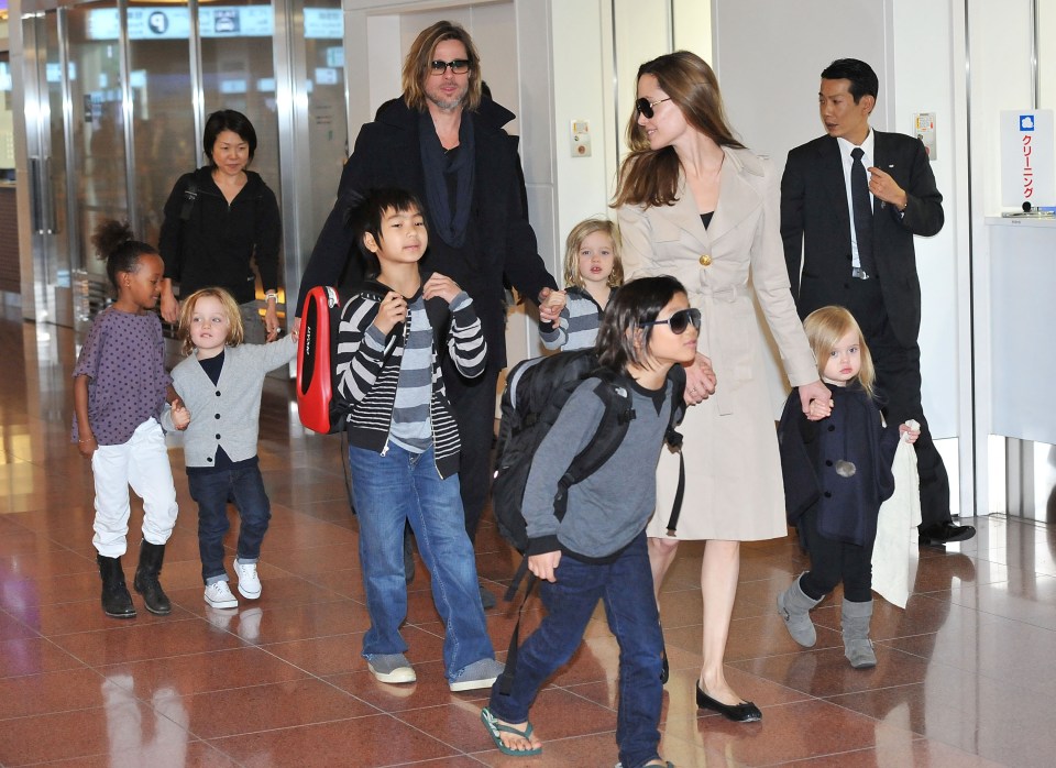  The happy couple with their six children at Tokyo airport in 2011