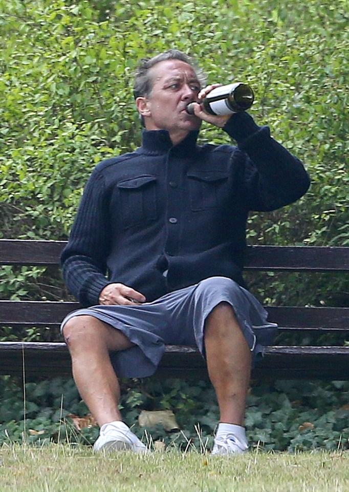  Kenny Sansom drinking on a park bench near former club Arsenal in Highbury