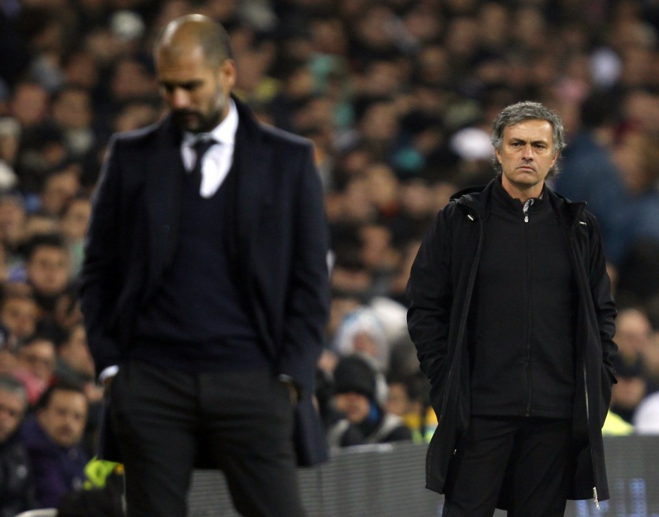  Jose Mourinho stares after Pep Guardiola during another lively El Clasico