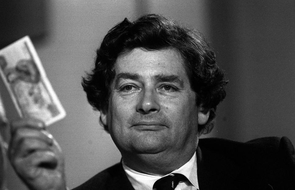  Pictured holding a £5 note in 1985, Nigel Lawson was the Chancellor from 1983 to 1989