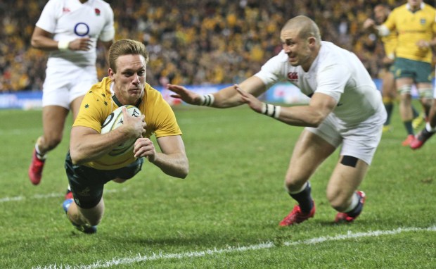 Mike Brown tries to stop Australia star Dane Haylett-Petty touching down as England win the series 3-0