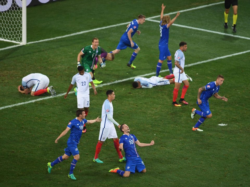  Iceland players celebrate while dejected England players hit the deck during their shock Euro 2016 loss