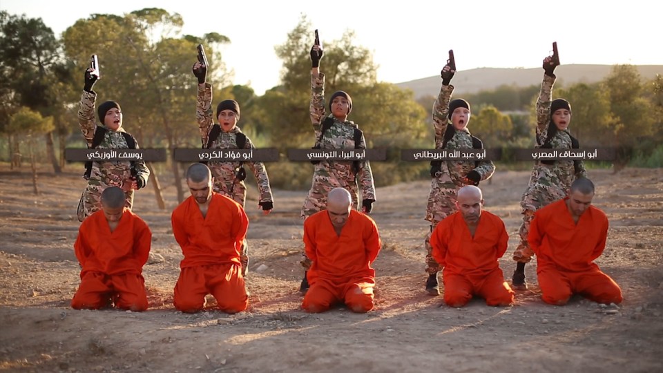 The children can be seen brandishing their weapons before murdering the prisoners