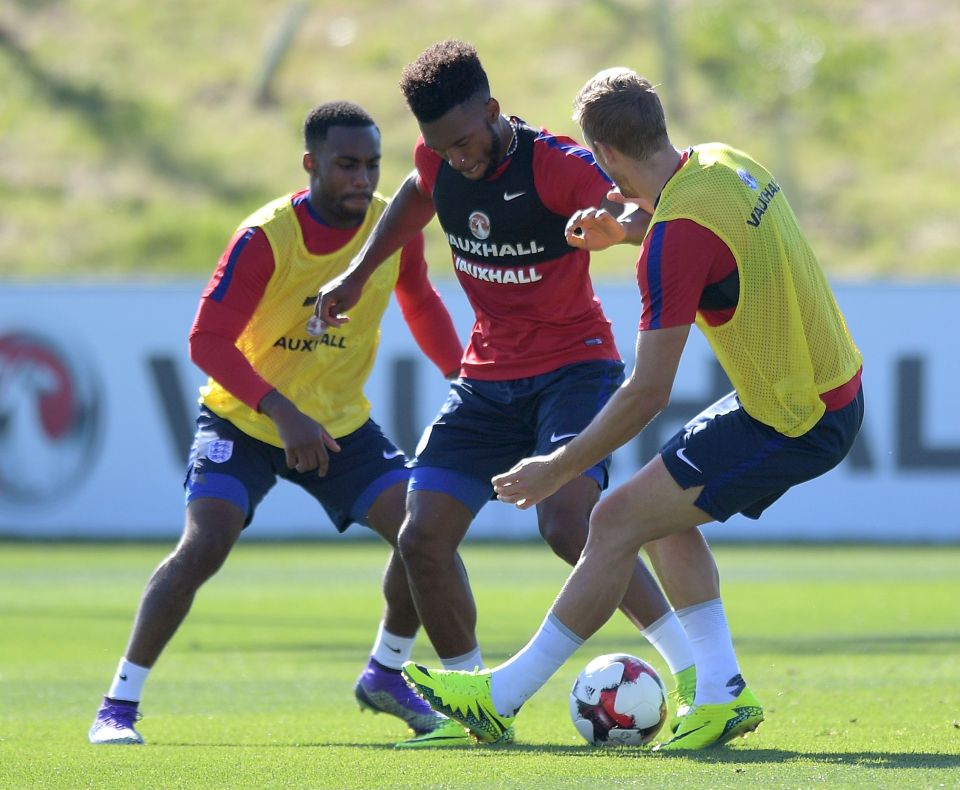  Rose and Harry Kane tackle Daniel Sturridge in England training last week