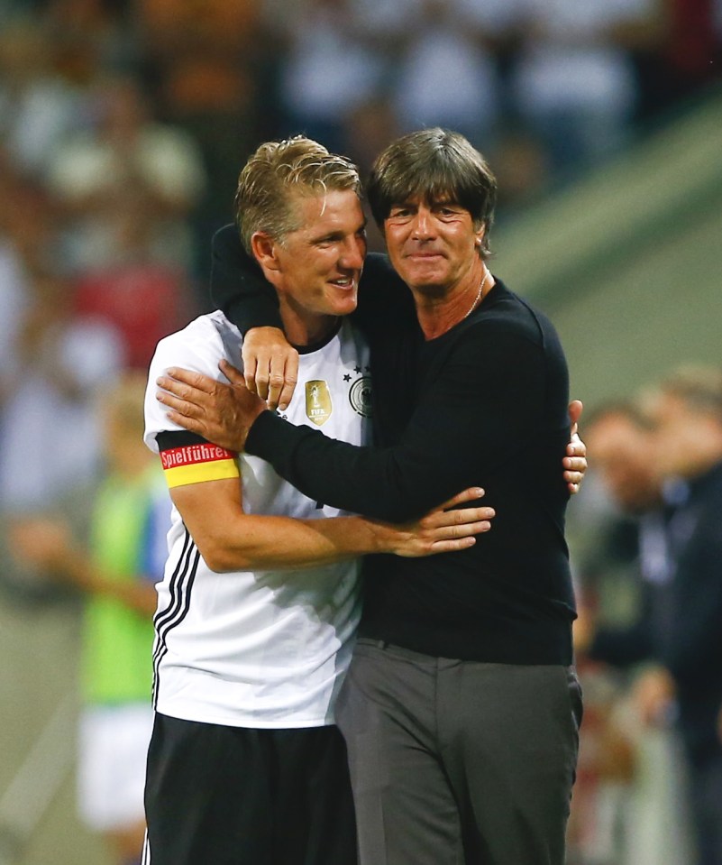  Schweinsteiger embraces Germany coach Joachim Low