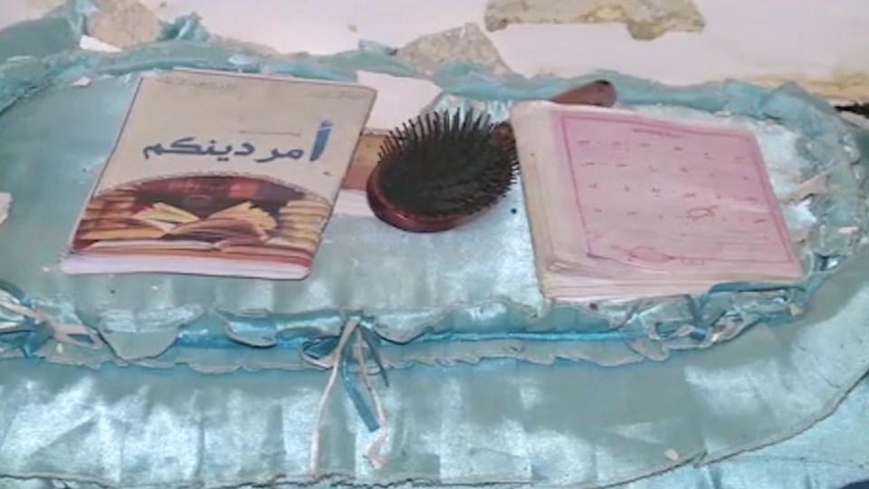  Personal items including a hairbrush and a notebook left behind by one of the prisoners