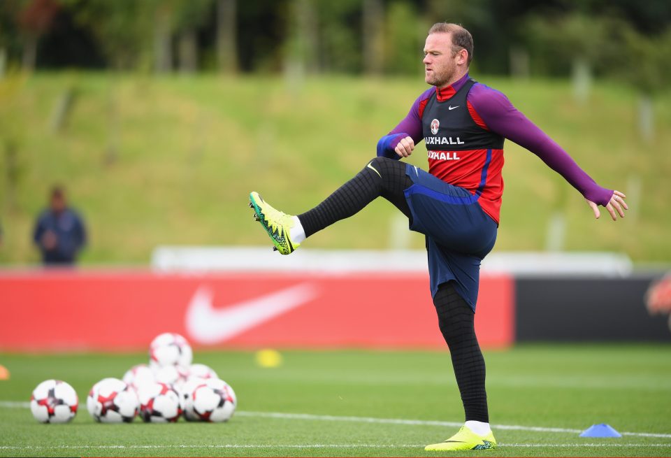  England skipper Wayne Rooney warms up ahead of the qualifier in Slovakia