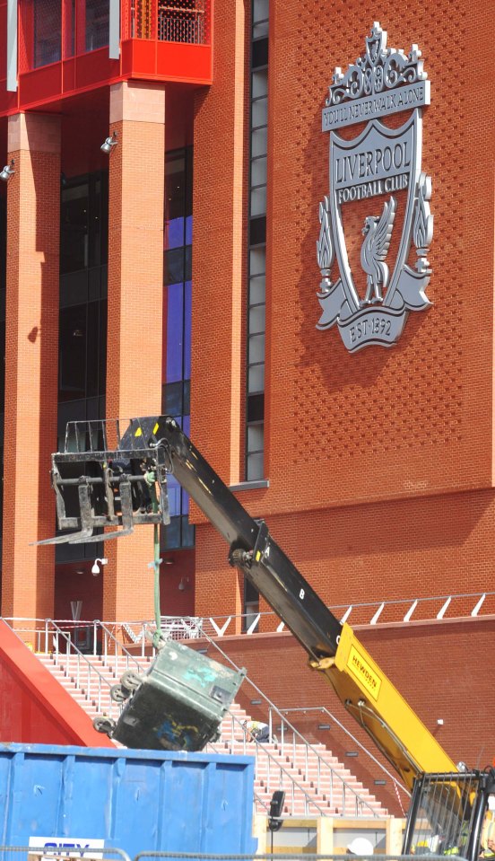  Workers put the finishing touches to Anfield last weekend