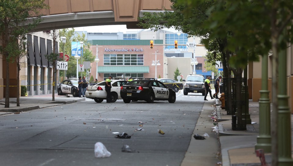  Police pictured at the scene are investigating the shooting