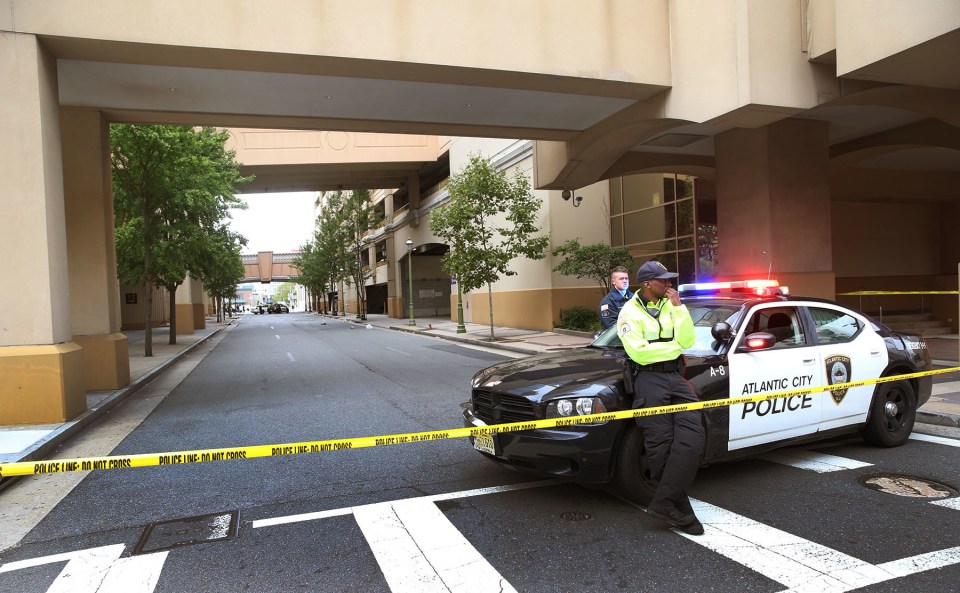  Authorities say a New Jersey police officer remains in critical condition after he was shot during an exchange of gunfire outside the casino