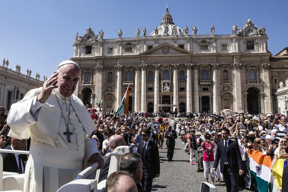  The Pope in his Pope-mobile greeting the crowds