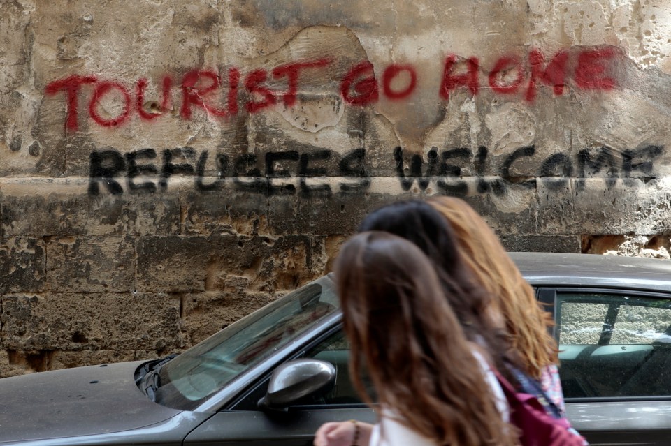  Slogans demanding tourists go home have been written over the Old Town walls in Palma