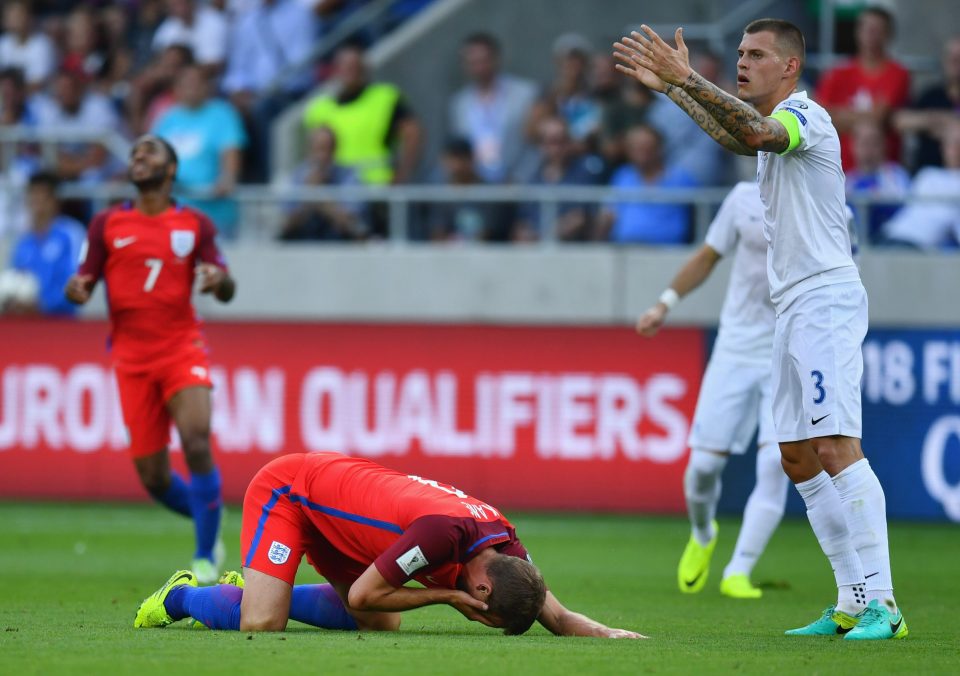  Martin Skrtel pleads his innocence after he was shown a yellow card for elbowing Harry Kane in the face