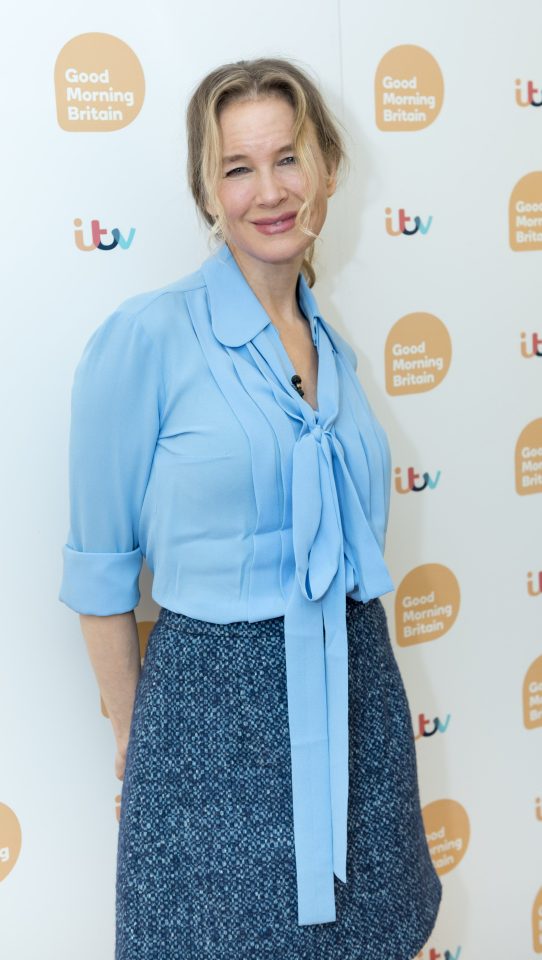 Renee looked stylish in a pale blue shirt and skirt 