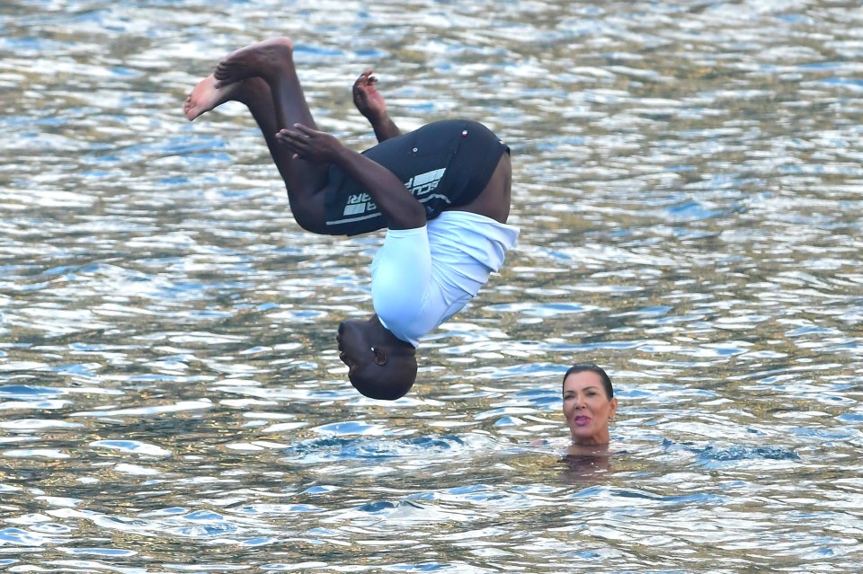  Kris looked on as beau Corey did flips into the water